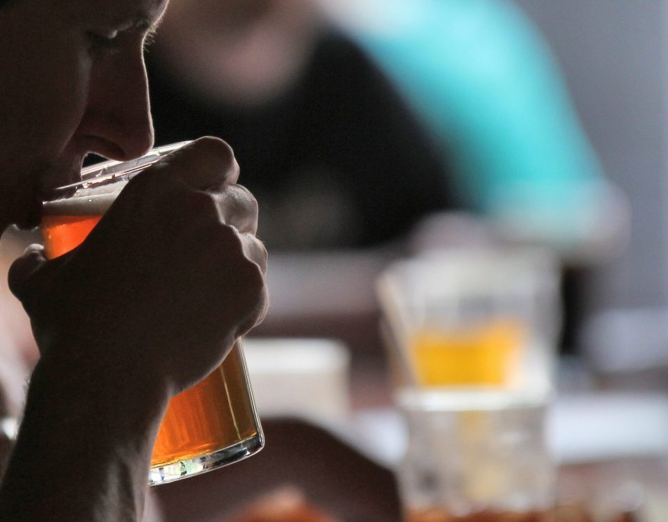 man tasting craft beer