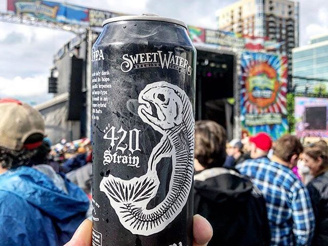 can of sweetwater G13 IPA at festival