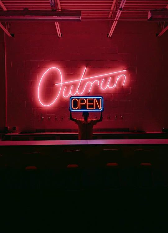 neon sign "open" for outrun brewing